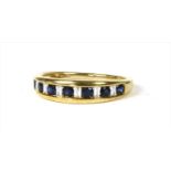 A gold sapphire and diamond half eternity ring,