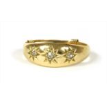 An 18ct gold three stone diamond ring,