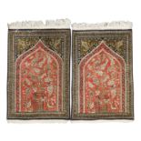A pair of hand-knotted Qum silk prayer rugs,