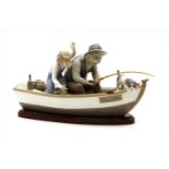 A large Lladro figure of a fishing trip,