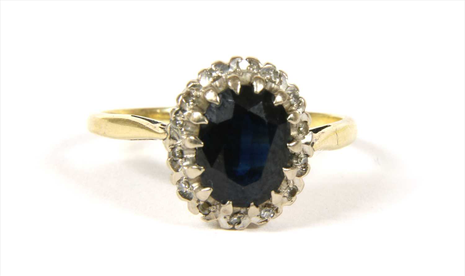 A gold sapphire and diamond cluster ring,