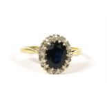 A gold sapphire and diamond cluster ring,