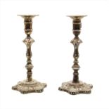 A pair of silver candlesticks,