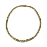 A gold graduated Greek key design necklace,