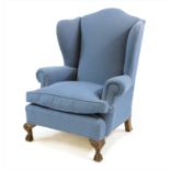 A George III style wingback armchair,