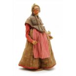 A Jouglas carved wood figure of a traditional 19th century French lady,