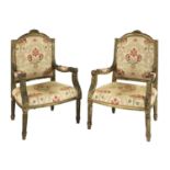A pair of French Empire-style giltwood open armchairs,