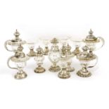 A matched set of twelve Dutch white metal and cut-glass condiments,