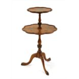 A satinwood and painted two tier occasional table,