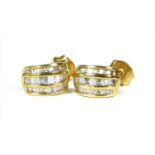 A pair of silver gilt diamond stud earrings,