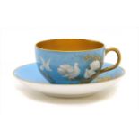 A Royal Worcester powder blue cup and saucer,