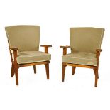 A pair of oak lounge chairs,