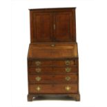 A George III oak bureau bookcase