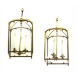 A pair of brass three light hall lanterns,