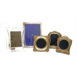 Three silver photograph frames,