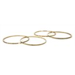 Four 9ct gold bangles,