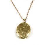 A 9ct gold oval hinged locket,