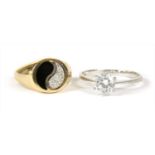 A gold diamond and enamel yin and yang ring,
