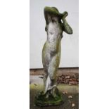 A composition concrete garden statue,