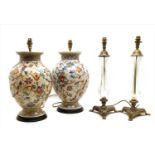 A pair of brass and glass table lamps,
