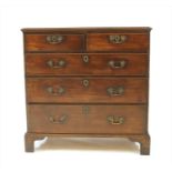 A George III mahogany chest of two short over three long drawers,