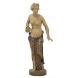 A Goldscheider painted terracotta figure of a girl holding a ball,