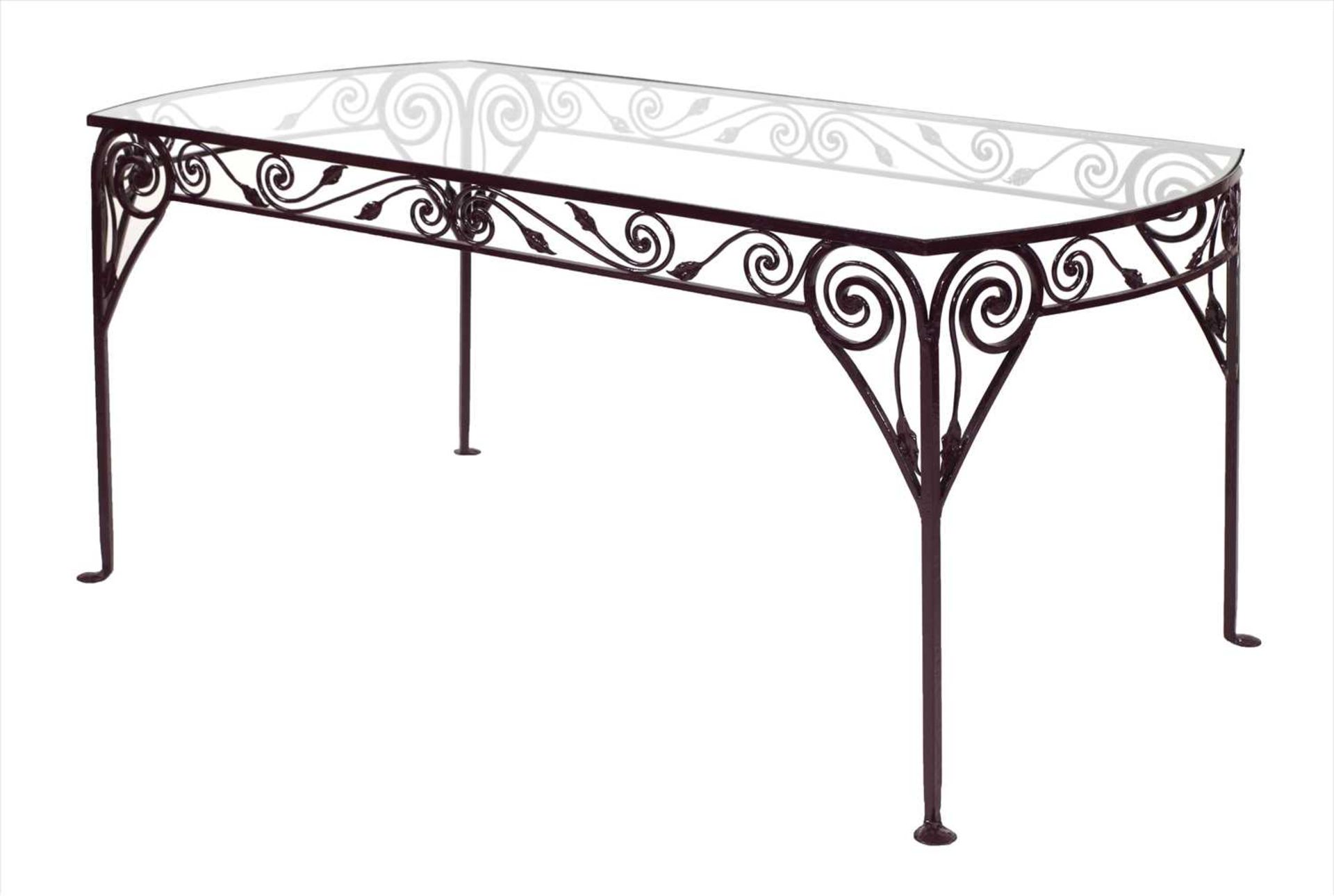 A contemporary wrought iron dining table,