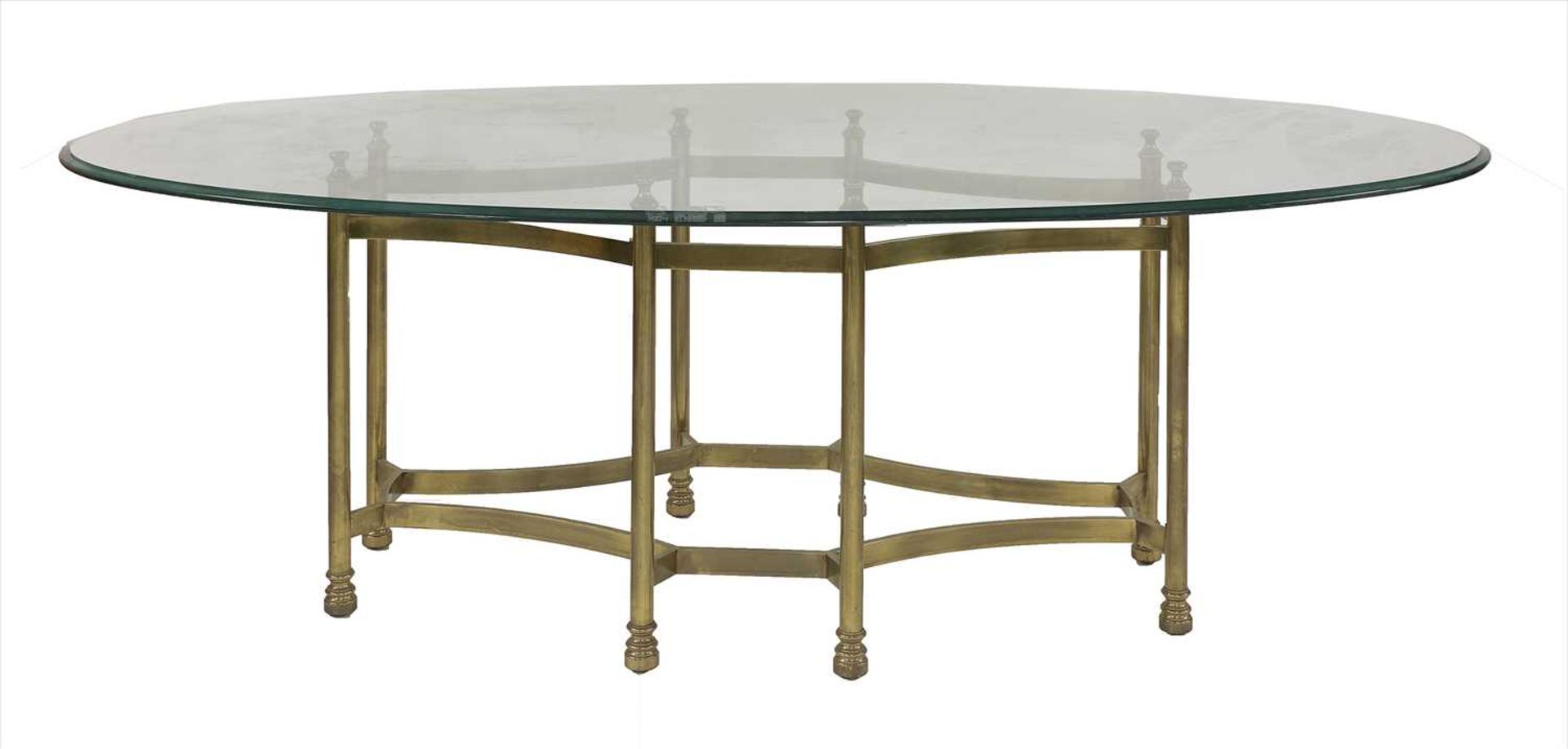 An oval glass top centre table,