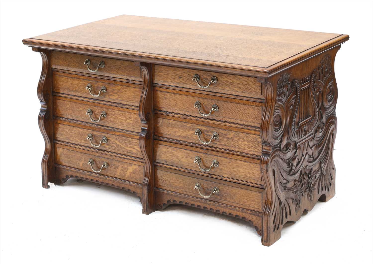 An oak ten-drawer music cabinet,