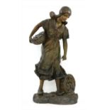 An Art Nouveau painted plaster fisherwoman,