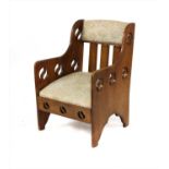 An Arts & Crafts oak armchair,