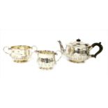 A silver three-piece tea set,