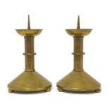 A pair of brass pricket candlesticks,