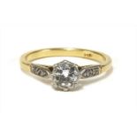 A gold single stone diamond ring,