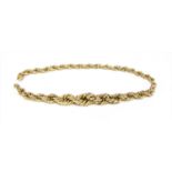A section of gold hollow graduated rope link chain,