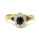 A gold sapphire and diamond cluster ring,