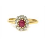 A gold ruby and diamond cluster ring,