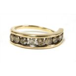 A gold diamond half eternity ring,