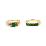 A gold emerald and diamond ring,