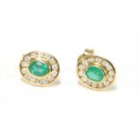 A pair of 9ct gold emerald and diamond cluster earrings,