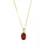 A gold treated ruby pendant,