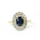 A gold sapphire and diamond cluster ring,