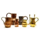 A collection of 18th century and later ale jugs,