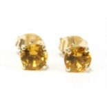 A pair of gold single stone citrine stud earrings,