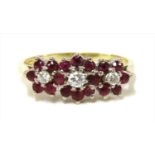 An 18ct gold diamond and ruby triple cluster ring,