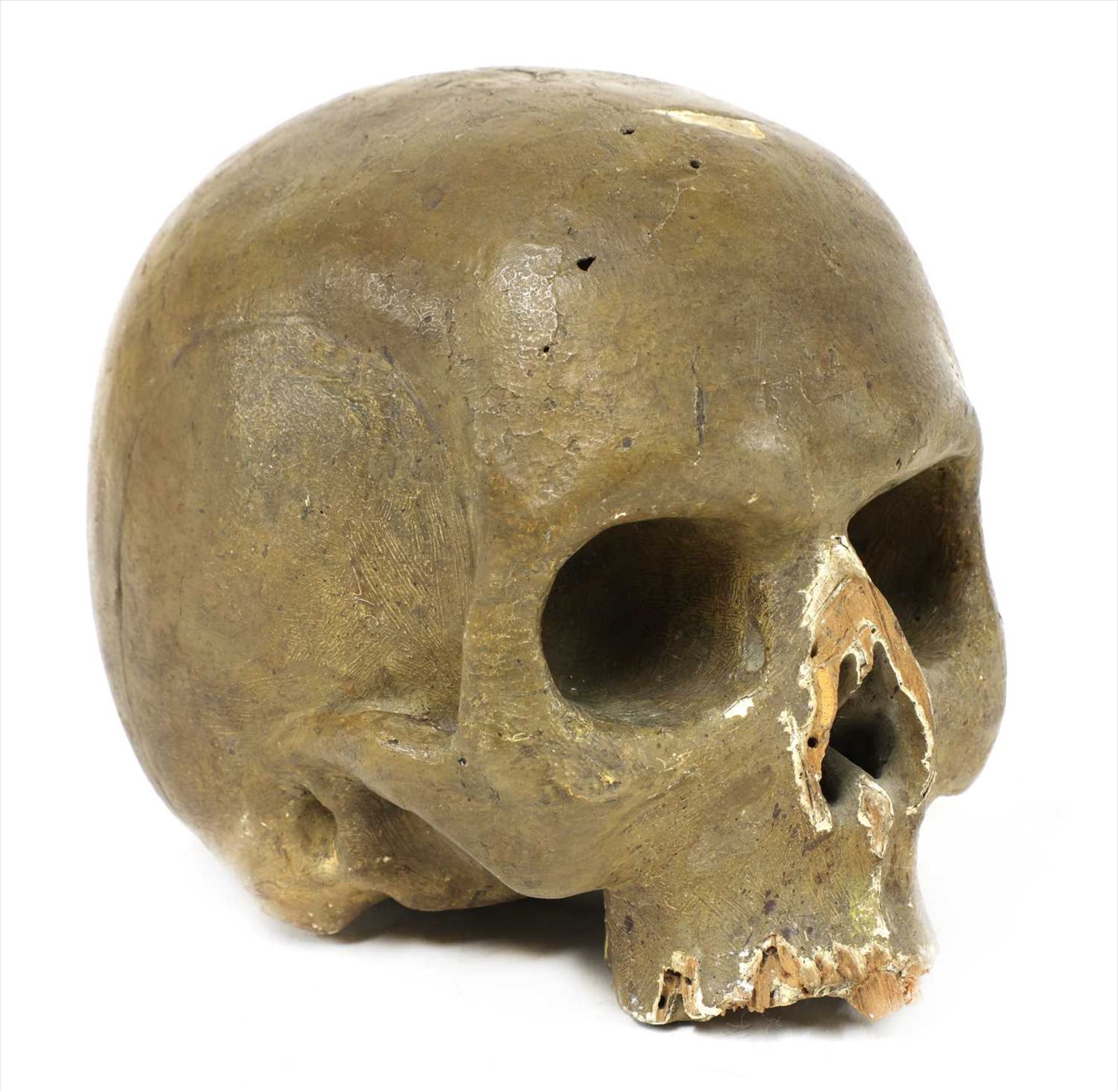 AN ITALIAN CARVED WOODEN LIFE-SIZE MODEL OF A SKULL,