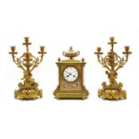 A matched French gilt bronze clock garniture