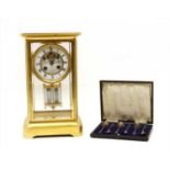 A French four glass mantel clock,