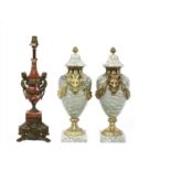 A pair of neoclassical-style veined marble cassolettes,