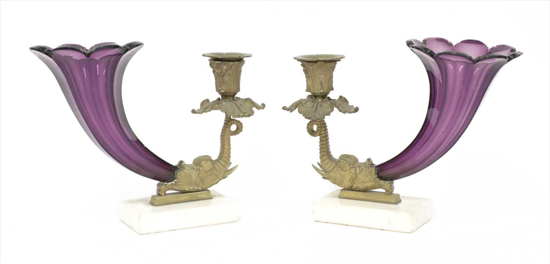 A pair of amethyst glass vases,